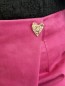 Jupe short broche Esmée fuschia