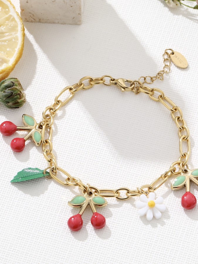 Bracelet doré avec cerises et marguerite